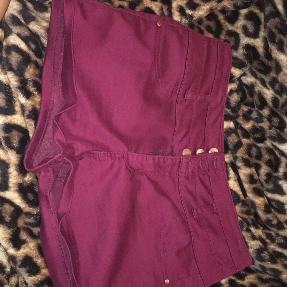 Burgundy shorts.